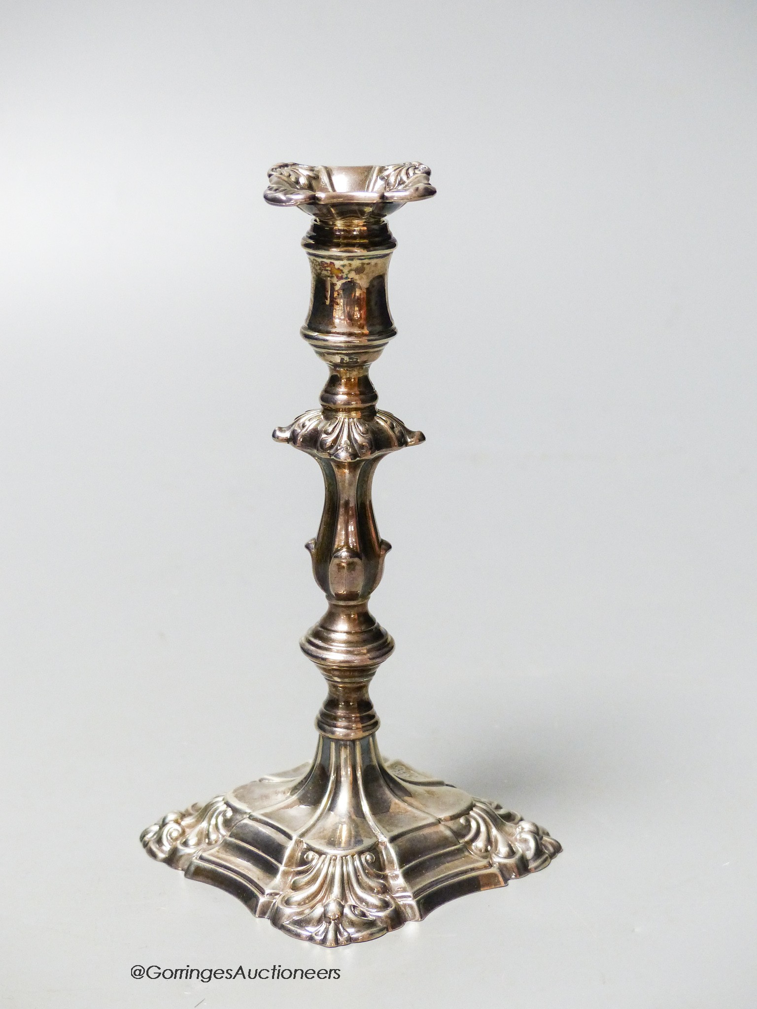 A William IV silver taperstick, with waisted knopped stem and engraved monogram below a coronet, Kitchen & Walker, Sheffield, 1835, 13.8cm, 121 grams.